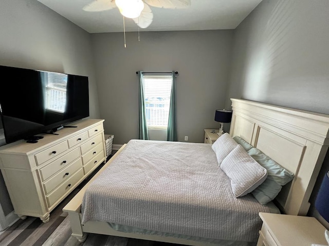bedroom with a ceiling fan and wood finished floors