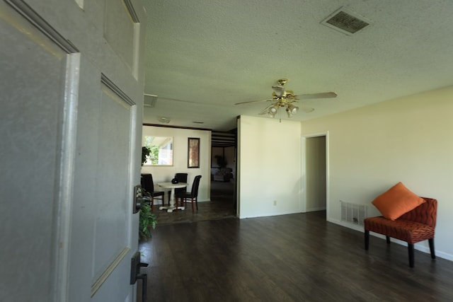 view of patio with ceiling fan and visible vents