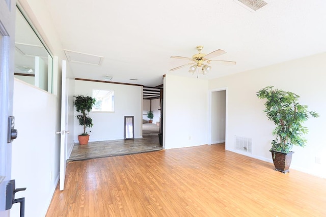 unfurnished room featuring ceiling fan and light hardwood / wood-style flooring