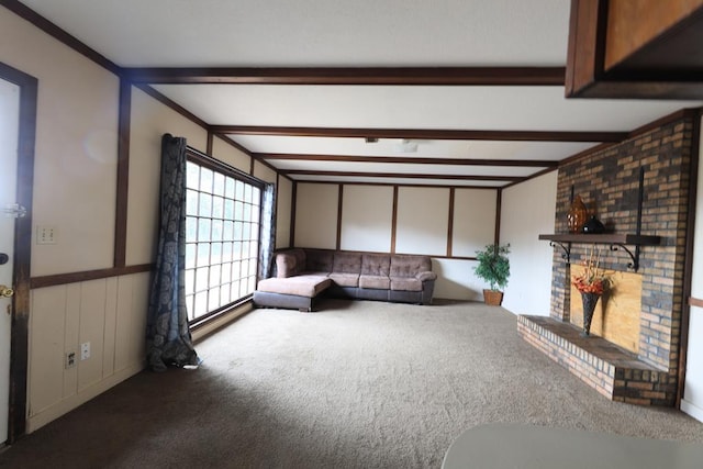 806 Mayfair St, Dothan, AL 36301 - unfurnished living room featuring carpet floors, a brick fireplace, beam ceiling, and a wainscoted wall