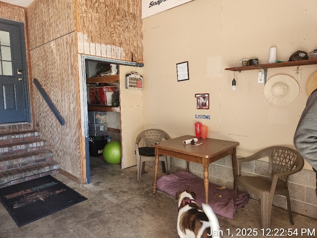 dining area featuring concrete floors