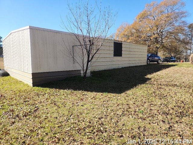 view of home's exterior featuring a yard