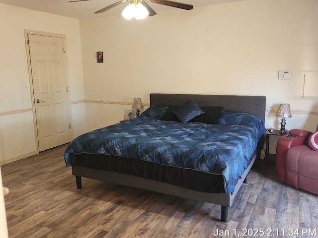 bedroom featuring hardwood / wood-style floors and ceiling fan