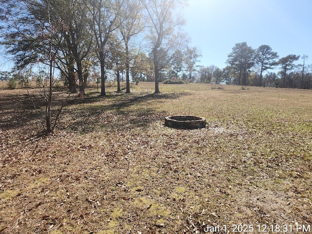 view of yard with a rural view