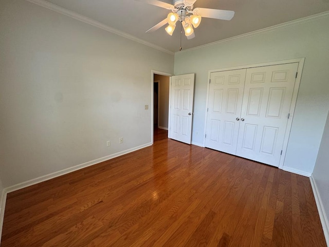 108 Sunshine Ln, Dothan, AL 36303 - unfurnished bedroom with baseboards, wood finished floors, crown molding, a closet, and a ceiling fan
