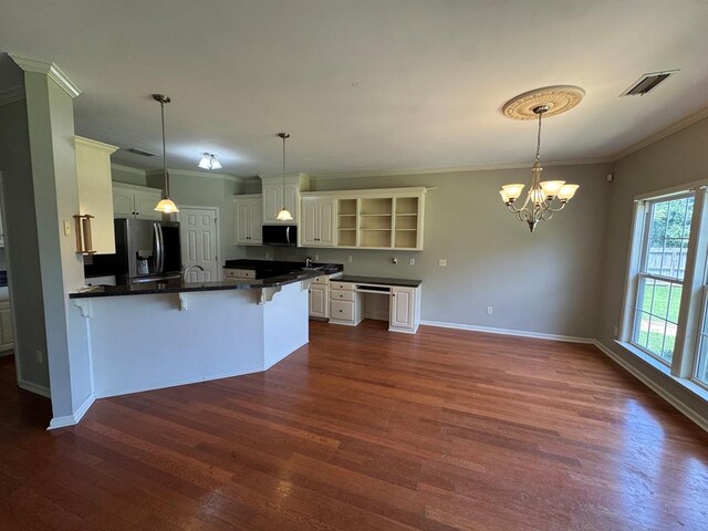 108 Sunshine Ln, Dothan, AL 36303 - kitchen with open shelves, appliances with stainless steel finishes, dark countertops, crown molding, and dark wood-style flooring