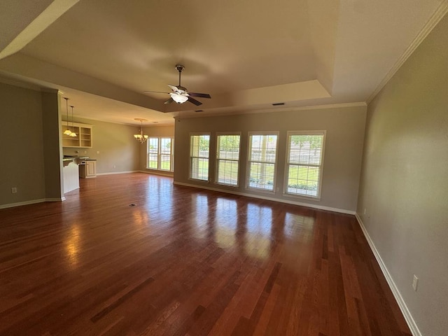 108 Sunshine Ln, Dothan, AL 36303 - unfurnished living room with ceiling fan, baseboards, a chandelier, a tray ceiling, and dark wood finished floors