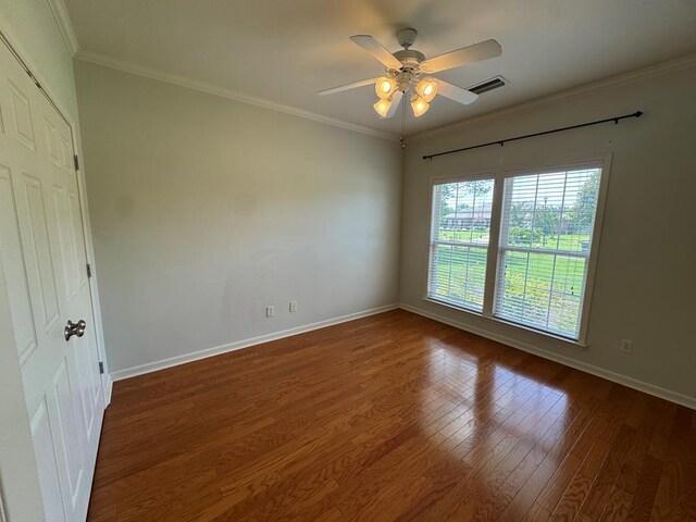 108 Sunshine Ln, Dothan, AL 36303 - spare room with wood finished floors, ceiling fan, baseboards, and ornamental molding