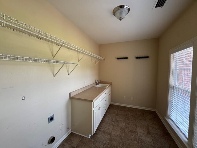 108 Sunshine Ln, Dothan, AL 36303 - washroom featuring hookup for an electric dryer, baseboards, and cabinet space