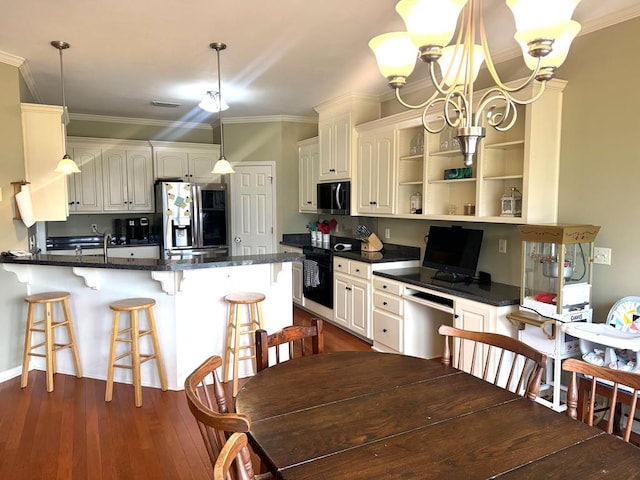 kitchen featuring ornamental molding, dark wood-type flooring, a peninsula, stainless steel appliances, and open shelves