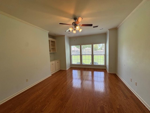 108 Sunshine Ln, Dothan, AL 36303 - unfurnished living room featuring a ceiling fan, baseboards, dark wood-type flooring, and crown molding