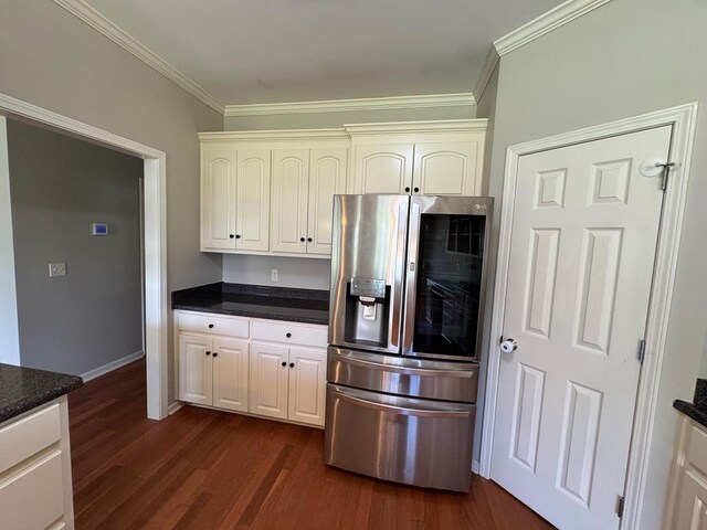 108 Sunshine Ln, Dothan, AL 36303 - kitchen featuring stainless steel fridge with ice dispenser, crown molding, dark wood-style flooring, baseboards, and white cabinets