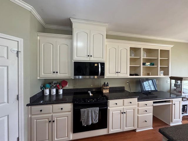 kitchen with open shelves, electric range, stainless steel microwave, and white cabinetry