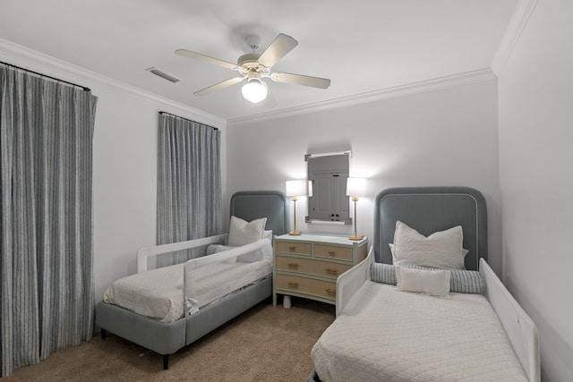 carpeted bedroom featuring ceiling fan and crown molding