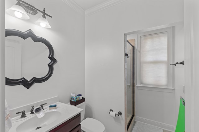 bathroom featuring vanity, toilet, ornamental molding, and a shower with shower door