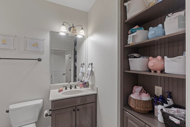 bathroom featuring vanity and toilet