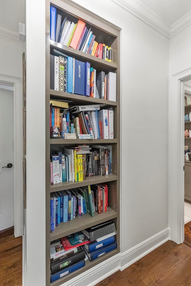 interior space featuring hardwood / wood-style flooring and ornamental molding