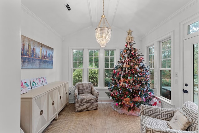 sitting room with crown molding, vaulted ceiling, and a notable chandelier