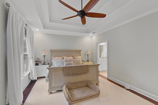 bedroom featuring ceiling fan, wood-type flooring, ornamental molding, and connected bathroom