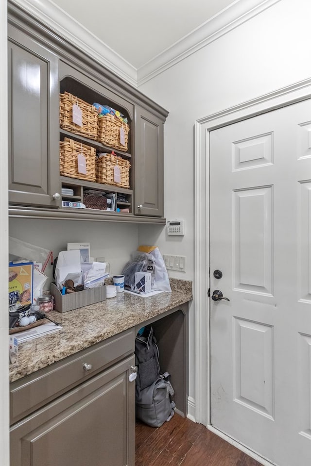 washroom with dark hardwood / wood-style flooring and ornamental molding