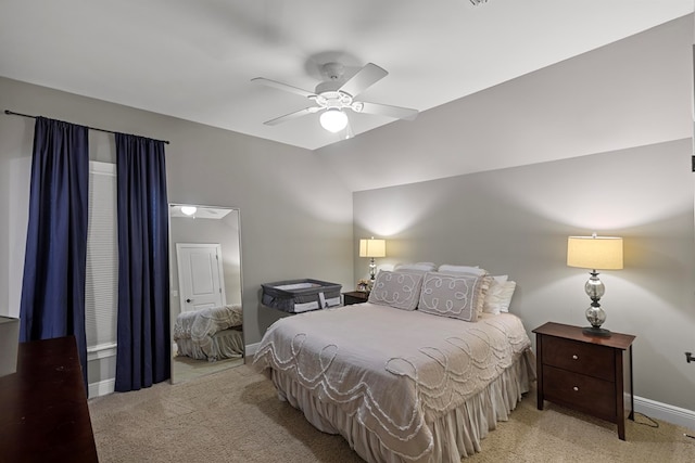 carpeted bedroom with ceiling fan and lofted ceiling