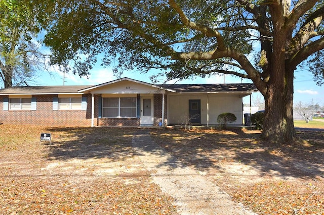 single story home featuring a carport