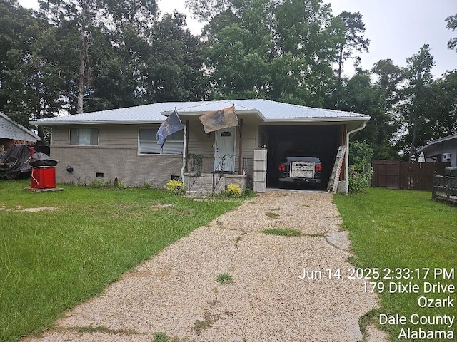 179 Dixie Dr, Ozark, AL 36360 - view of front of home featuring concrete driveway, a metal roof, crawl space, and a carport