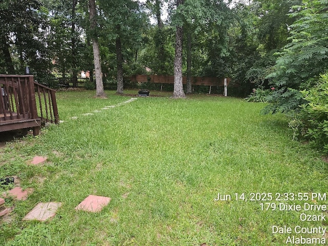179 Dixie Dr, Ozark, AL 36360 - view of green lawn featuring a wooden deck