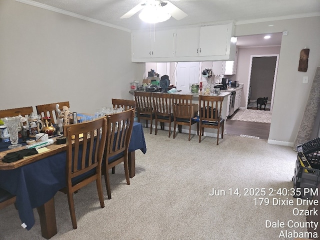 179 Dixie Dr, Ozark, AL 36360 - dining space with crown molding, light carpet, and a ceiling fan