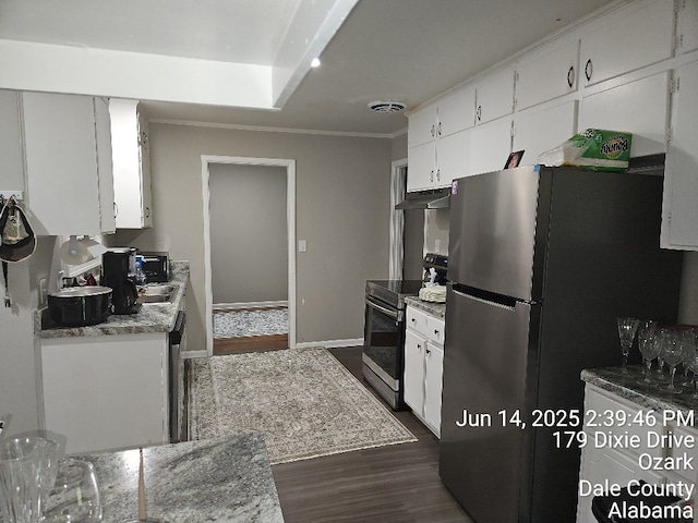 179 Dixie Dr, Ozark, AL 36360 - kitchen with appliances with stainless steel finishes, dark wood-style floors, white cabinets, and crown molding