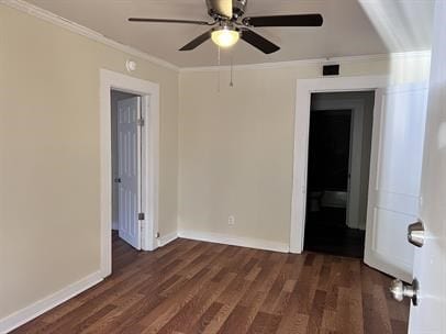 unfurnished room with dark hardwood / wood-style flooring, ceiling fan, and crown molding