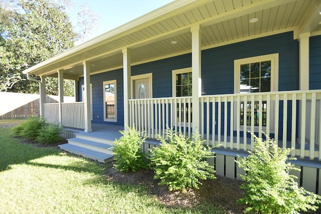 doorway to property featuring covered porch