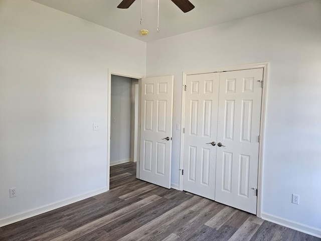 unfurnished bedroom featuring ceiling fan, dark wood-type flooring, and a closet