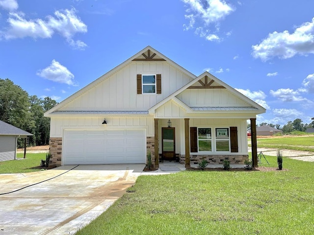 view of front of home with a garage and a front yard