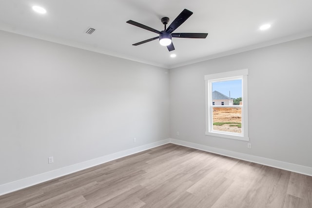 unfurnished room with crown molding, ceiling fan, and light wood-type flooring