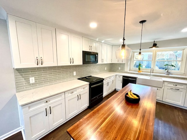 kitchen with white cabinets, sink, and black appliances