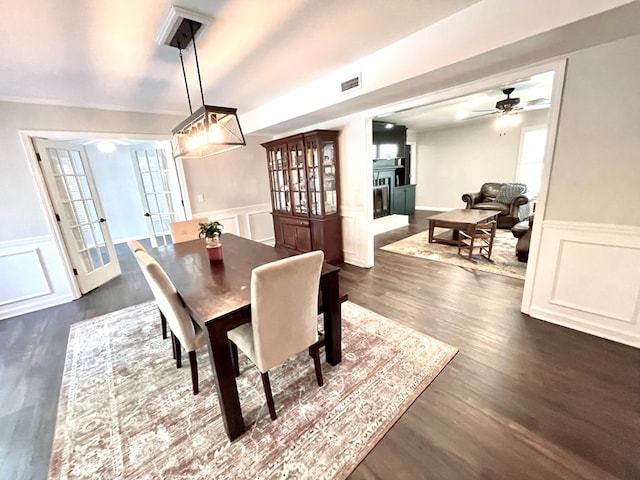 dining room with french doors, dark hardwood / wood-style floors, and ceiling fan