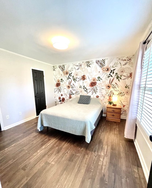 bedroom featuring dark wood-type flooring and ornamental molding