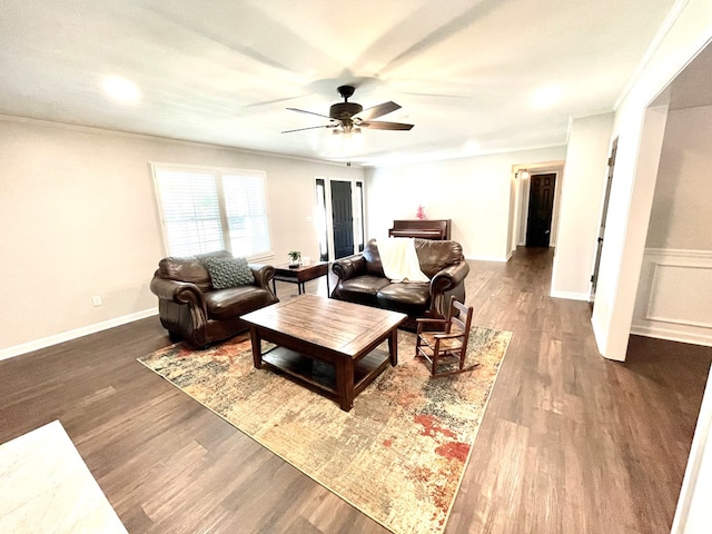 living room featuring hardwood / wood-style floors and ceiling fan