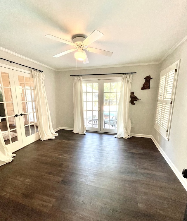 empty room with ceiling fan, french doors, dark wood-type flooring, and ornamental molding