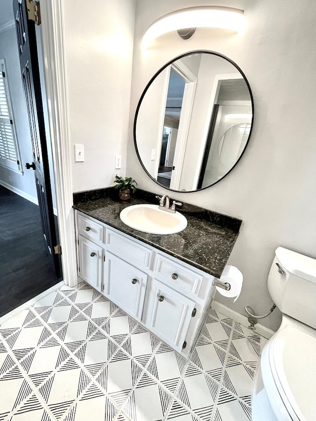 bathroom with vanity and toilet