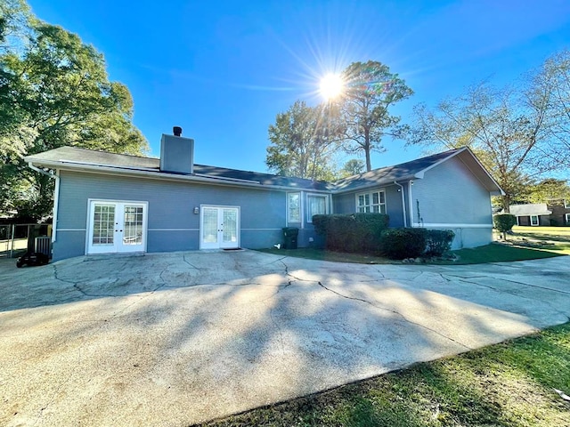 back of property featuring french doors