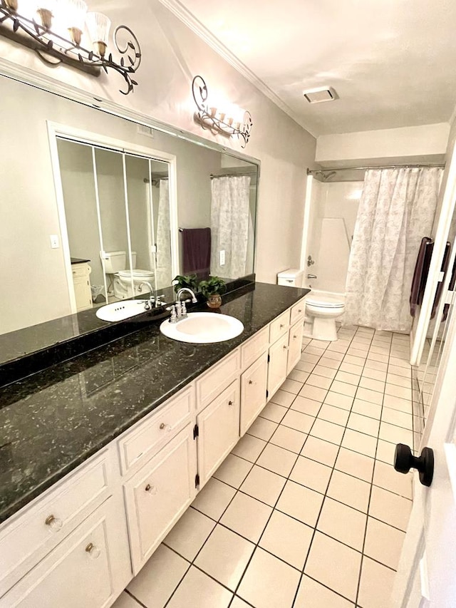 full bathroom featuring tile patterned flooring, crown molding, toilet, vanity, and shower / tub combo