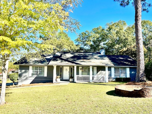 ranch-style home with a porch and a front lawn