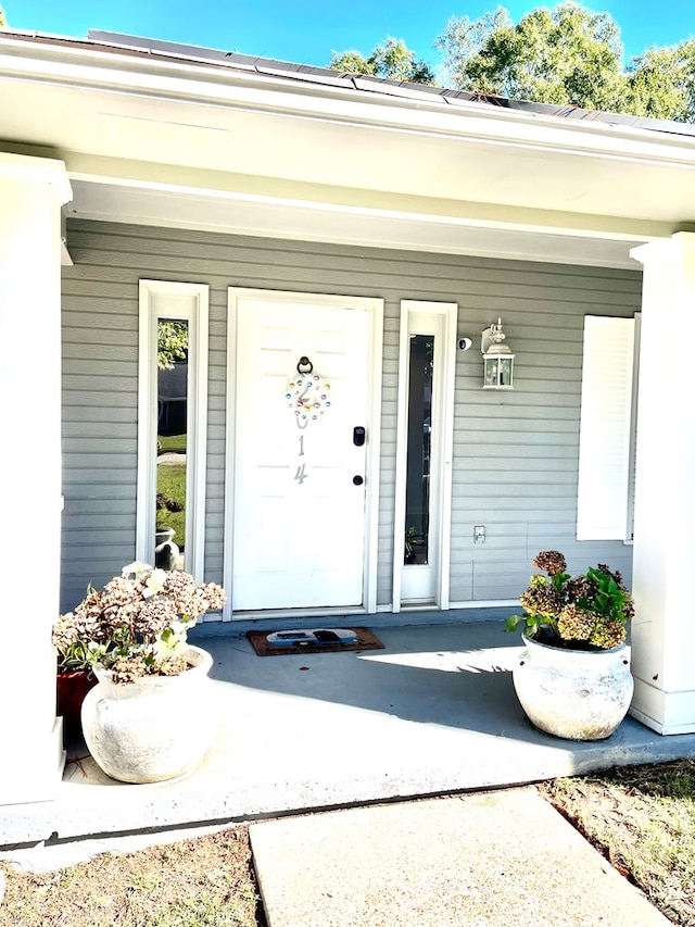 doorway to property featuring a porch