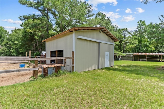 3195 Singletary Rd, Slocomb, AL 36375 - view of pole building featuring a lawn, view of wooded area, and an exterior structure
