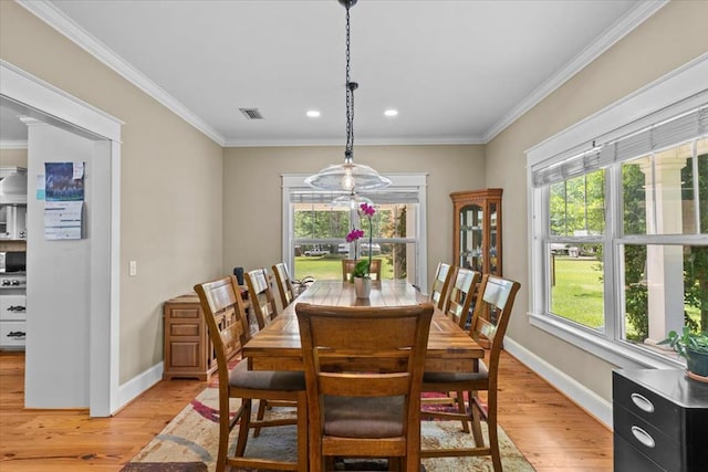 3195 Singletary Rd, Slocomb, AL 36375 - dining area with light wood-type flooring, plenty of natural light, ornamental molding, and recessed lighting
