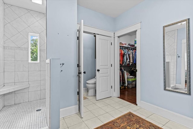 3195 Singletary Rd, Slocomb, AL 36375 - bathroom with a tile shower, tile patterned flooring, and a walk in closet