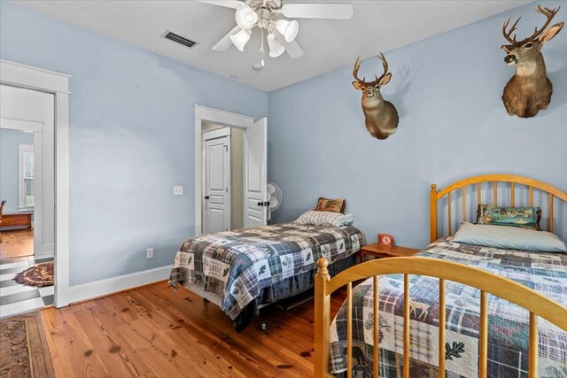 3195 Singletary Rd, Slocomb, AL 36375 - bedroom featuring wood finished floors and ceiling fan