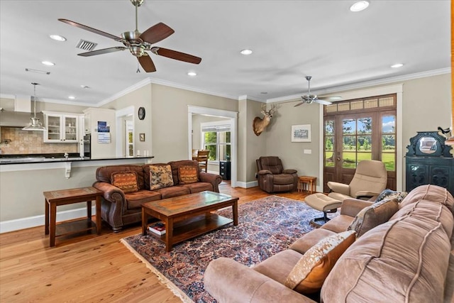 3195 Singletary Rd, Slocomb, AL 36375 - living room featuring ceiling fan, plenty of natural light, recessed lighting, light wood-type flooring, and crown molding
